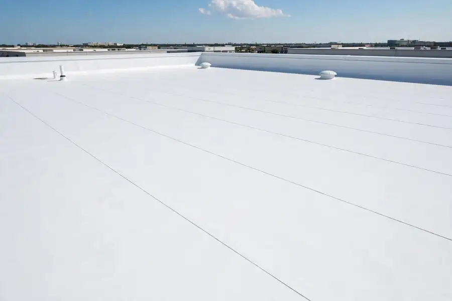 Flat roof with new white TPO membrane after repair